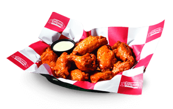 Traditional chicken wings in a basket