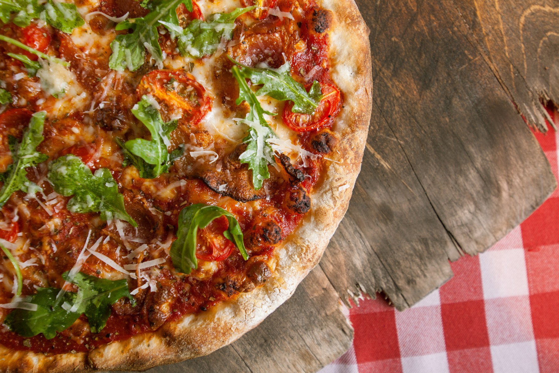 Stone‑baked pizza on wooden board